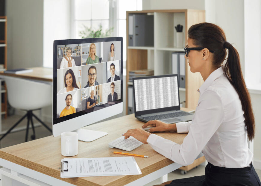 alt=Woman in smart business outfit taking part in an online video call of the Bizconverts Animated Video Team